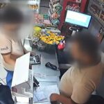 criminoso com criança no colo