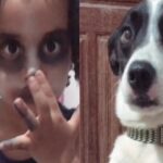 criança maquiada e cão